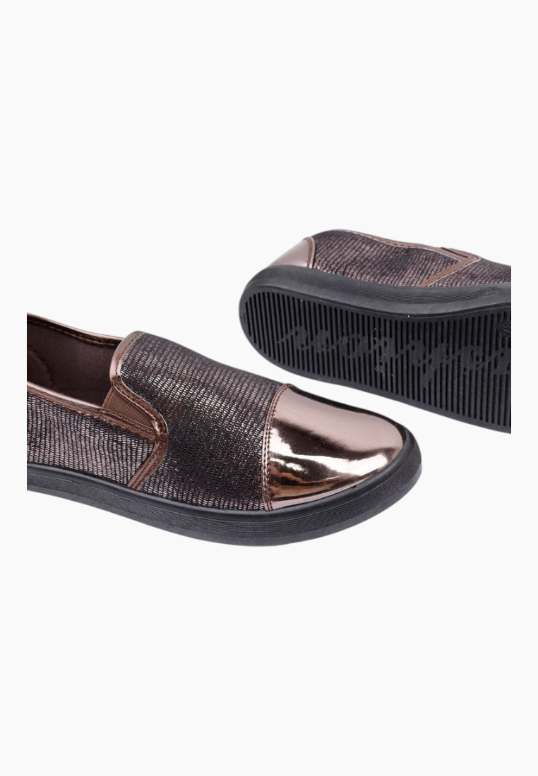 Detail view of the brown slip-on shoes with a focus on the metallic features.