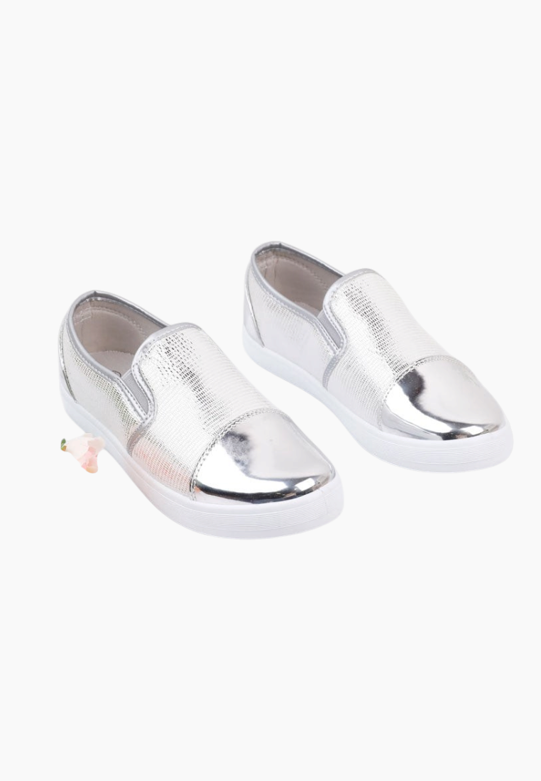 Front view of silver slip-on shoes with metallic finish.