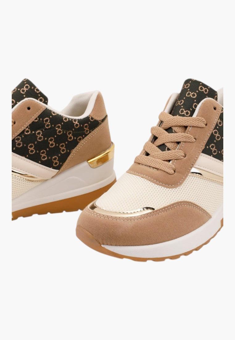 Szczegółowy widok brązowych sneakersów damskich z teksturowanym wierzchem.