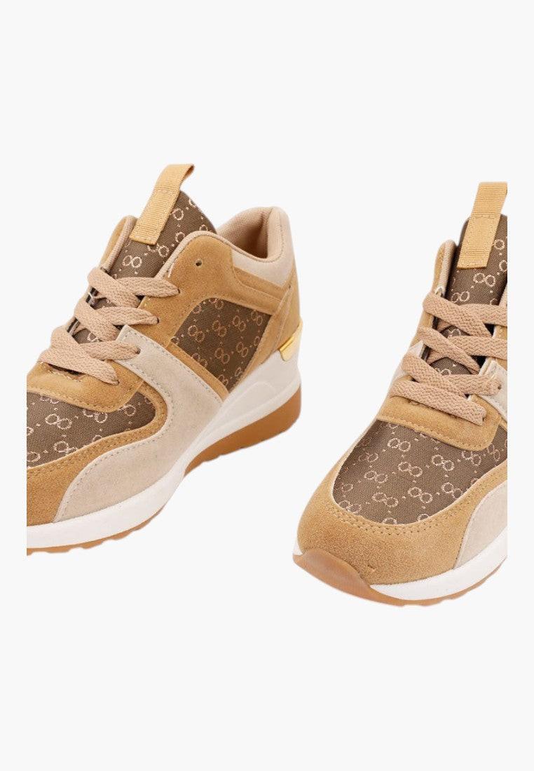 Side view of brown and beige sneakers with rubber sole and lace-up design.
