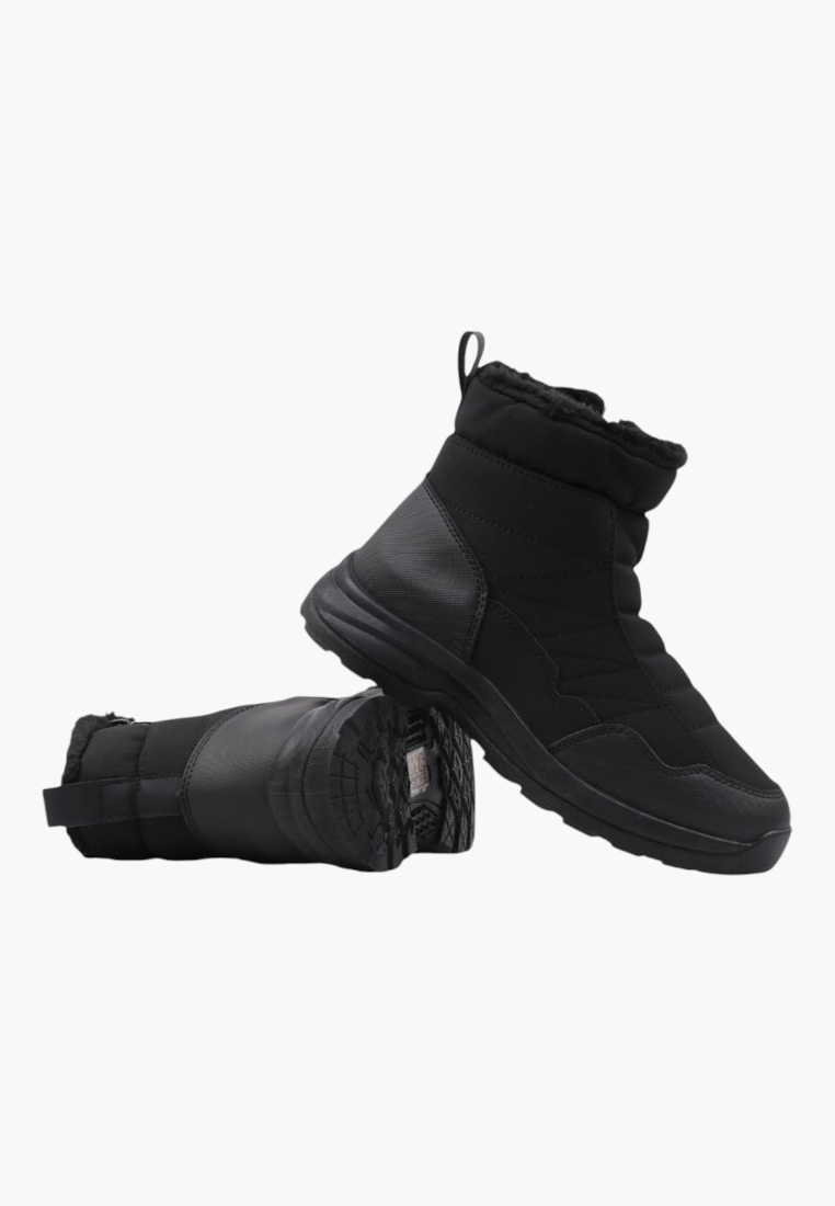 Side view of black winter boots with smooth finish and high ankle.