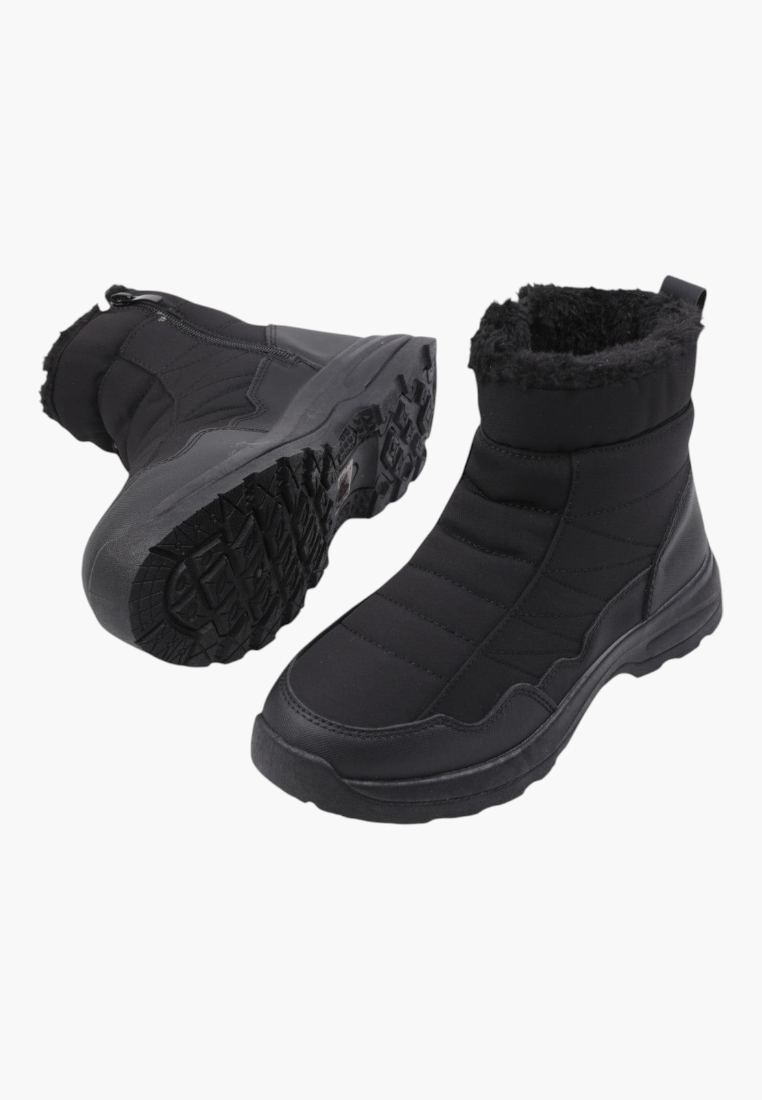 Side view of black ankle boots with textured upper and rubber sole.