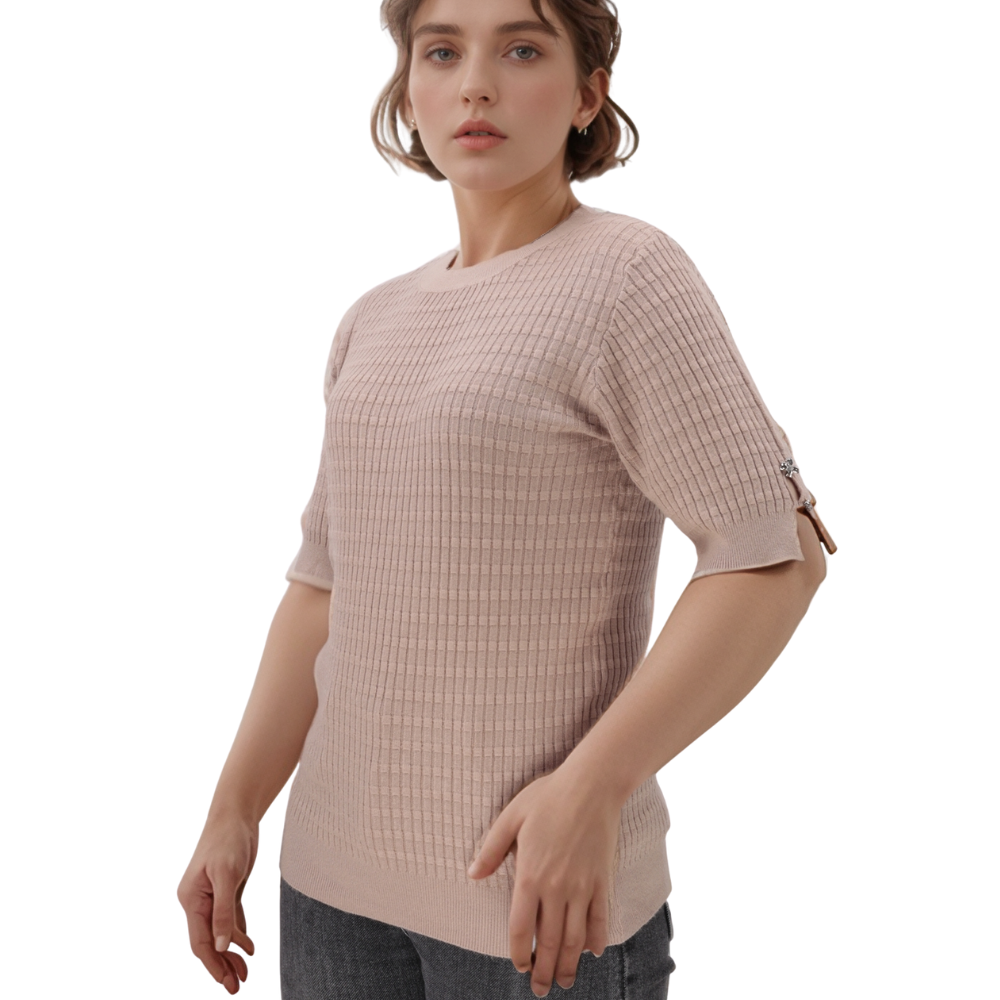 Side view of a light pink top showcasing short sleeves and textured fabric.