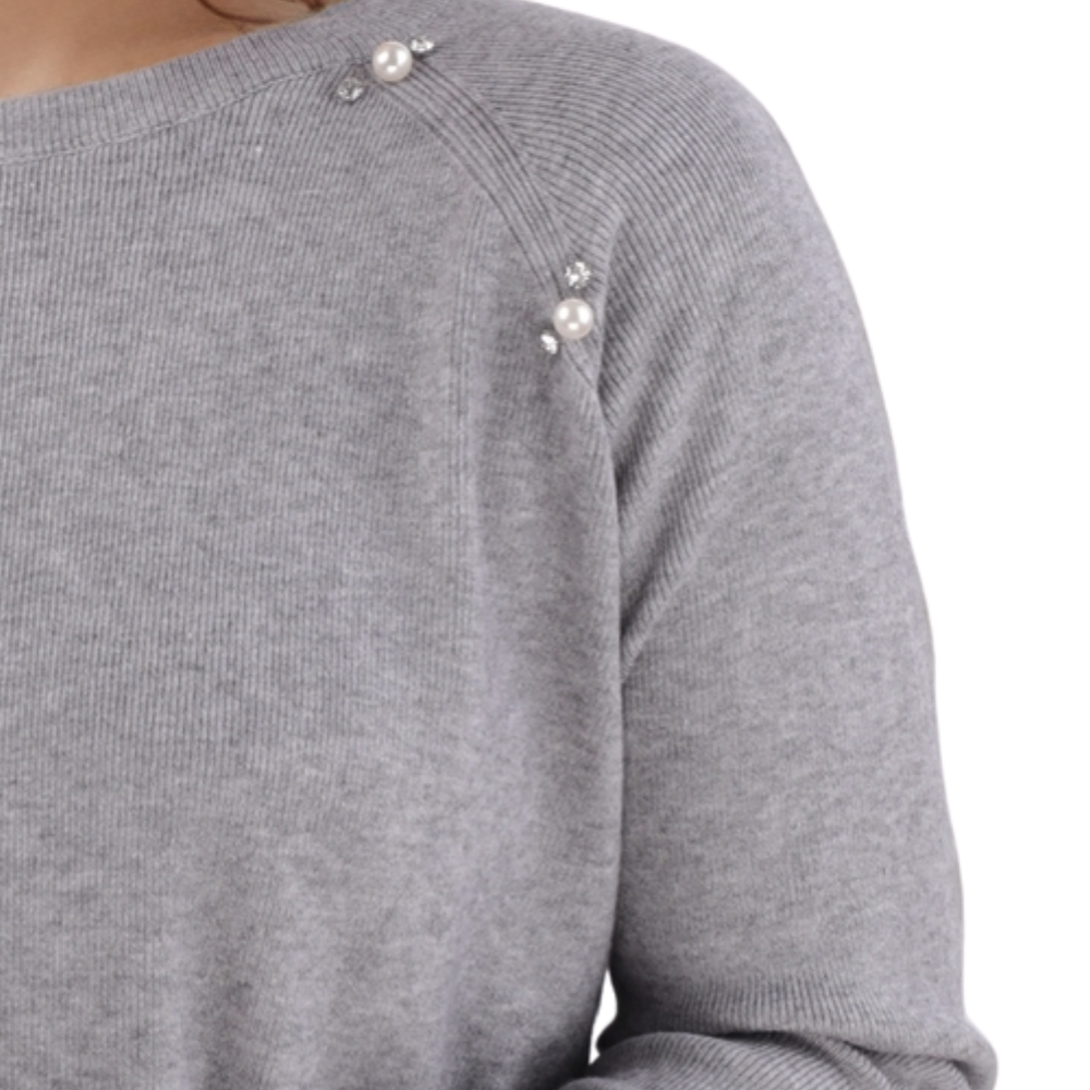 Detail close-up of the gray sweater showcasing soft fabric on a white background.