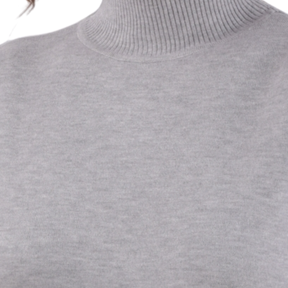 Detail close-up of the gray turtleneck sweater highlighting soft fabric.
