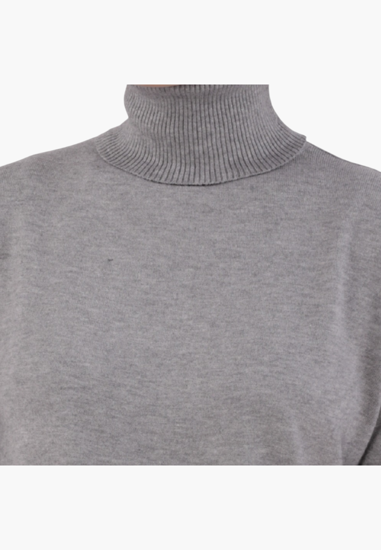Detail close-up of the gray turtleneck sweater showcasing its soft texture on a white background.