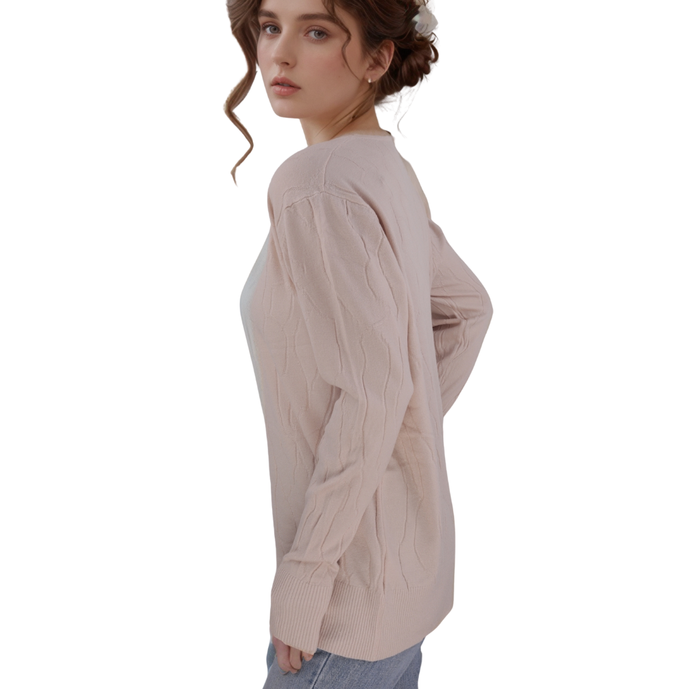 Back view of the light beige long sleeve sweter with button details.