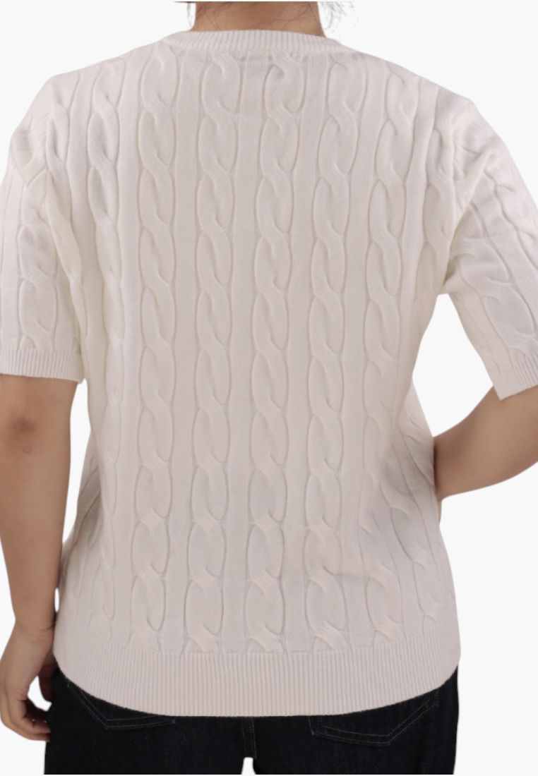 Back view of the cream short-sleeve sweter with button closure.