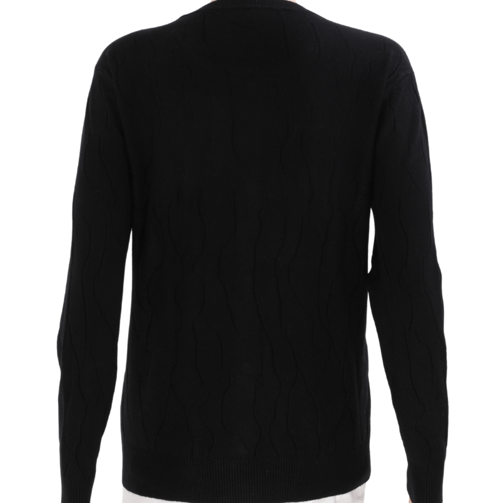 Back view of a black cardigan with long sleeves on a white background.