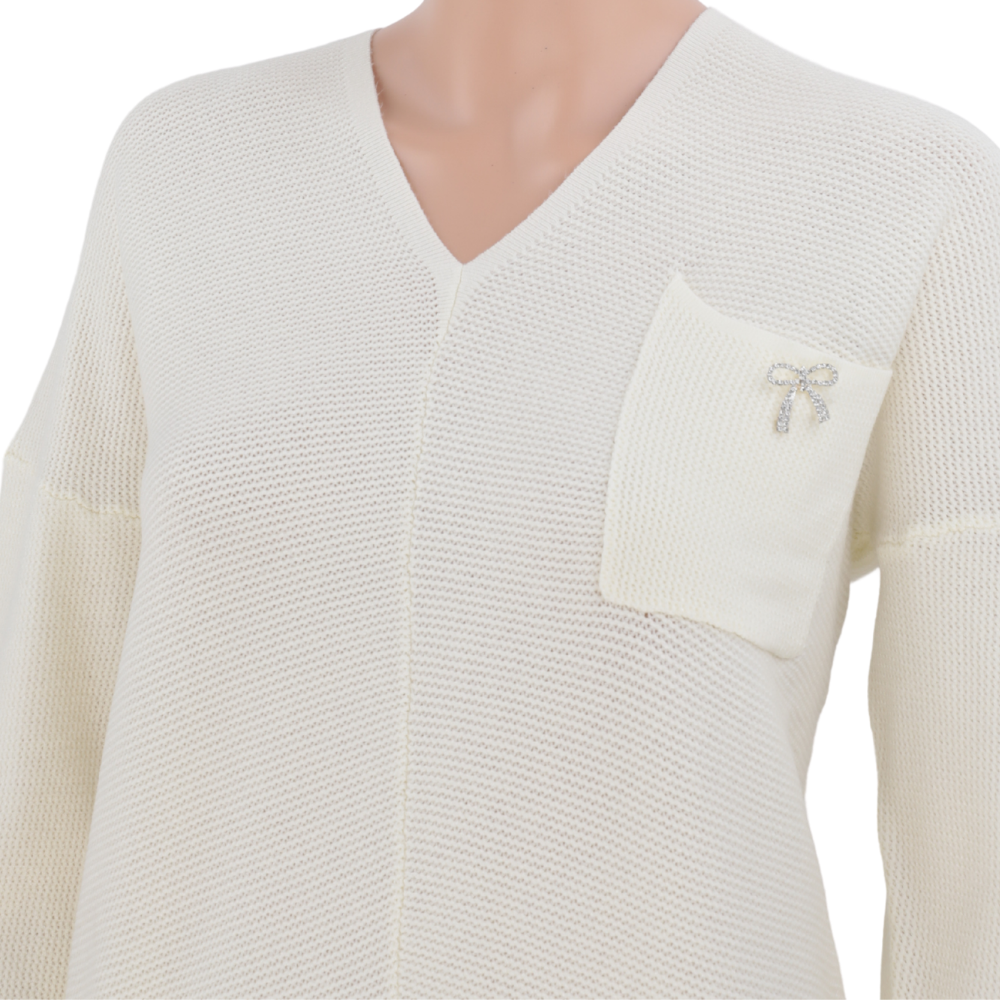 Back view of a cream v-neck sweater with a simple design on a white background.