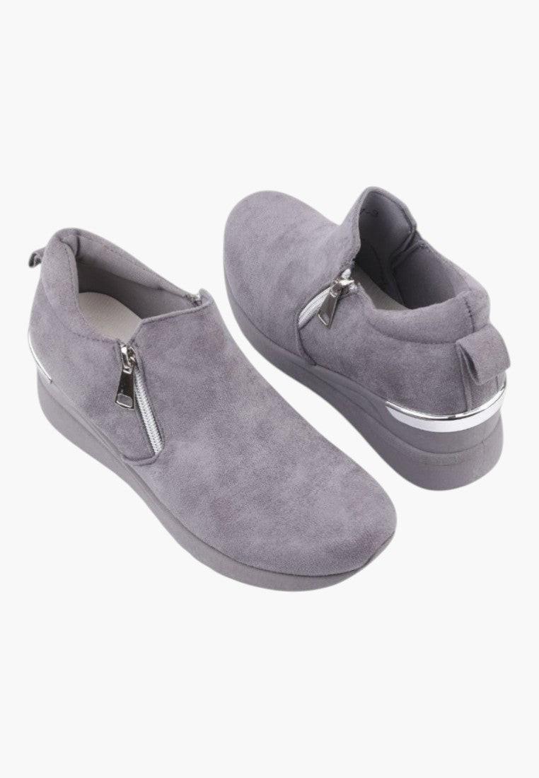 Another side view of gray eco-suede slip-on women's sneakers.