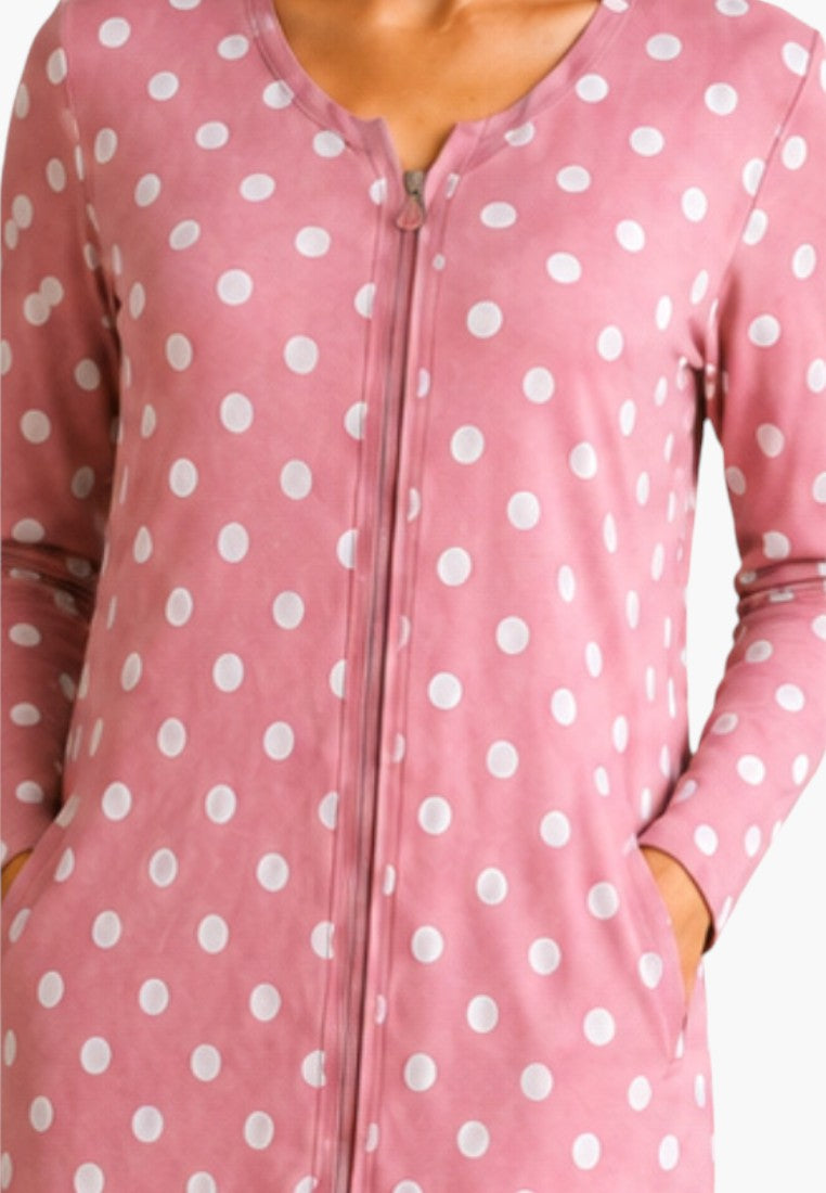 Detail view of a pink cotton robe featuring polka dots and side pockets.