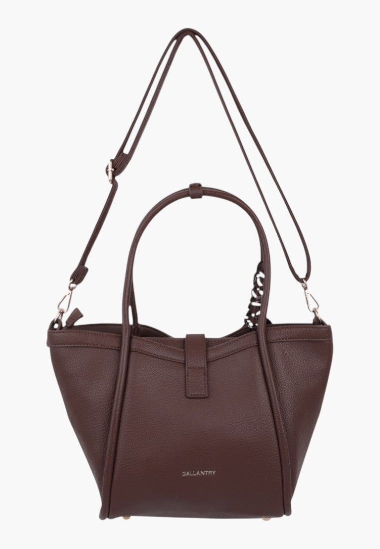 Back view of taupe faux leather handbag featuring dual handles and zipper closure.