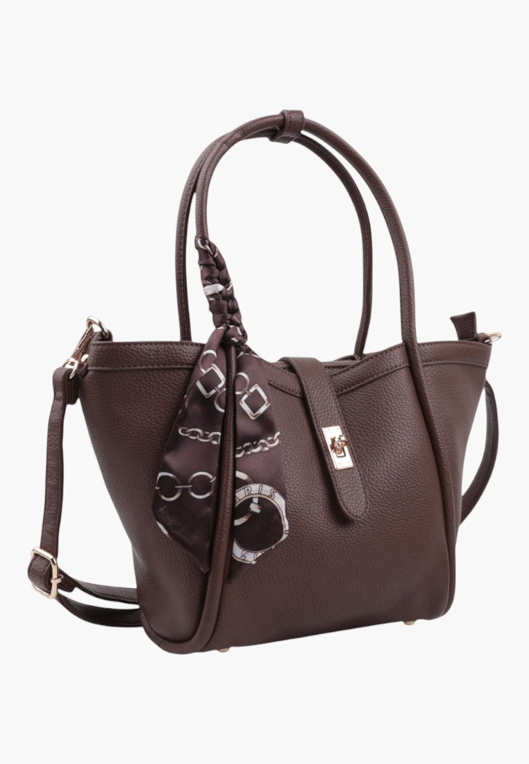 Front view of taupe faux leather shopper handbag with decorative scarf and double handles.