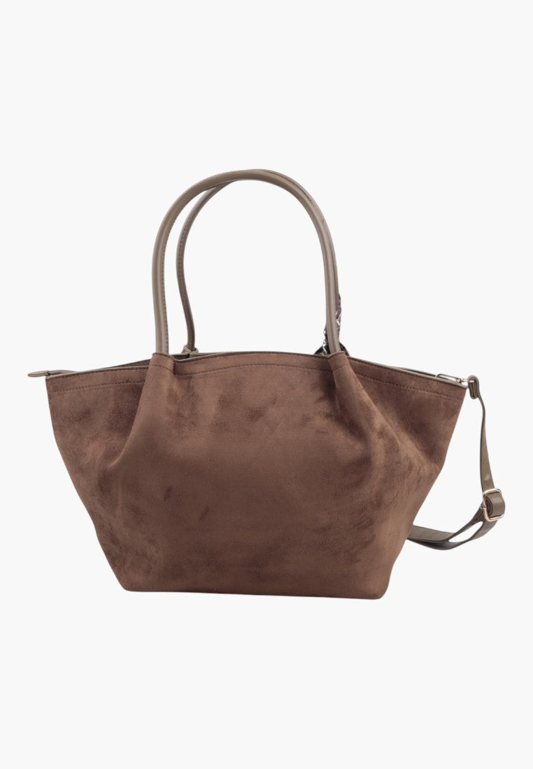 Close-up detail of the taupe faux suede shopper bag with zip closure and textured surface.