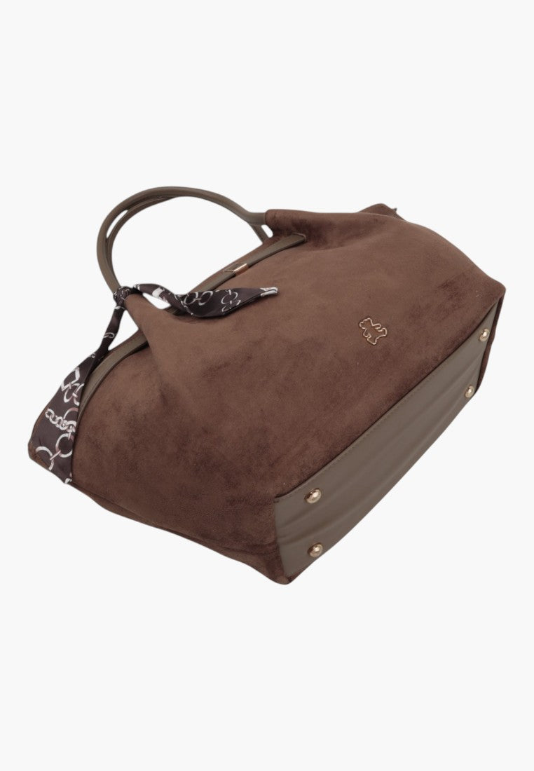 Side view of the taupe faux suede shopper bag with patterned scarf detail and gold-tone hardware.