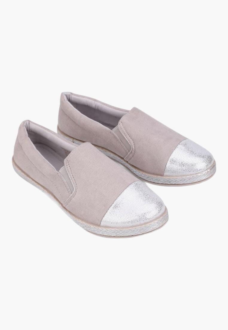 Front view of beige slip-on shoes with a shiny toe cap.