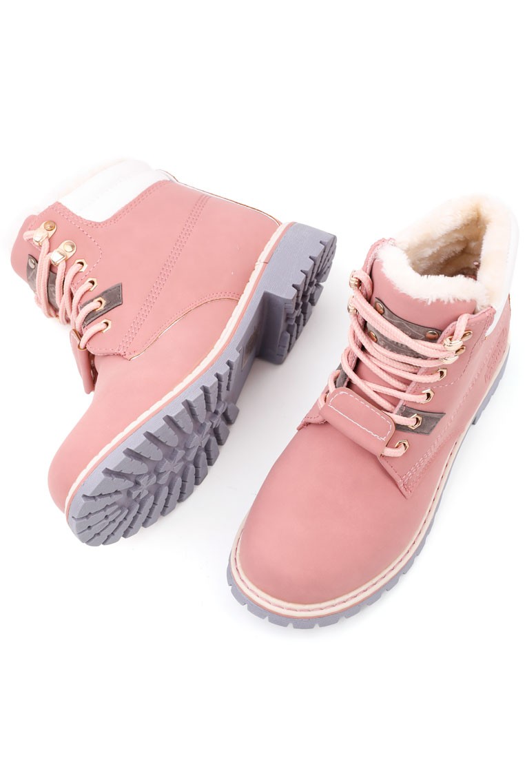 Close-up detail of pink boots showing fur lining and metallic eyelets on a white background.