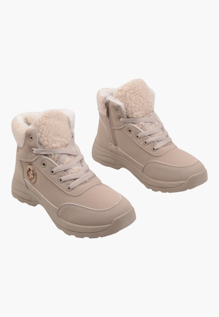 Lifestyle shot of beige winter boots with fur lining on a white background.