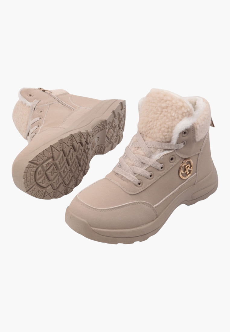 Side view of beige winter boots featuring textured sole and fur collar.