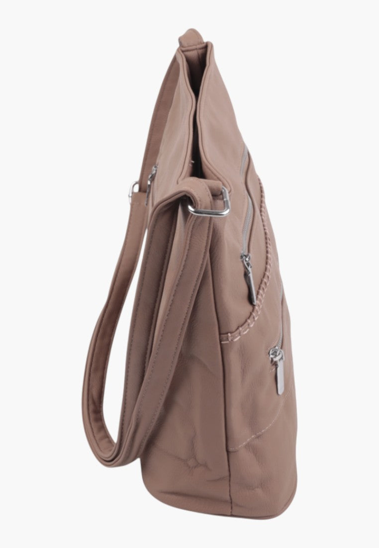 Side view of a brown shoulder bag with a slouchy design and zipper closure.