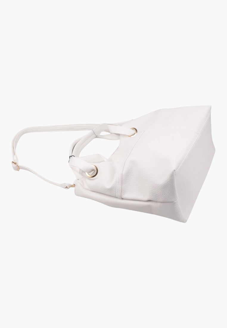 Side view of the wielokolorowej torebki damskiej shopper z regulowanym paskiem.