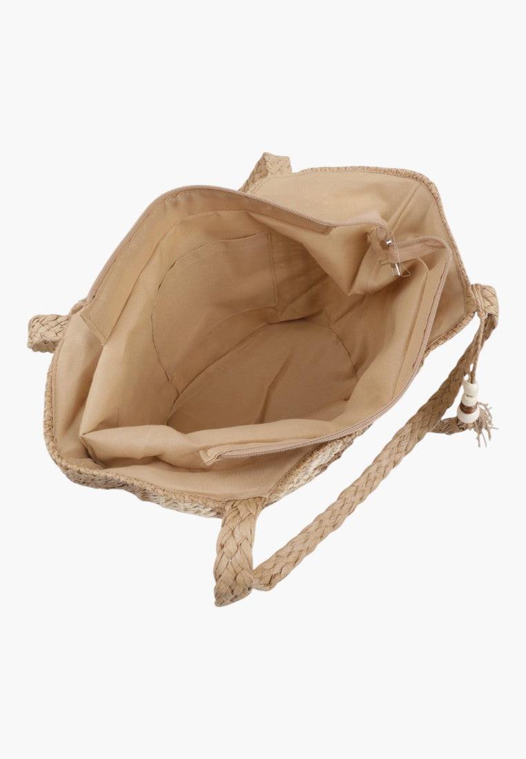 Widok z boku wielokolorowej torebki shopper z regulowanym paskiem.