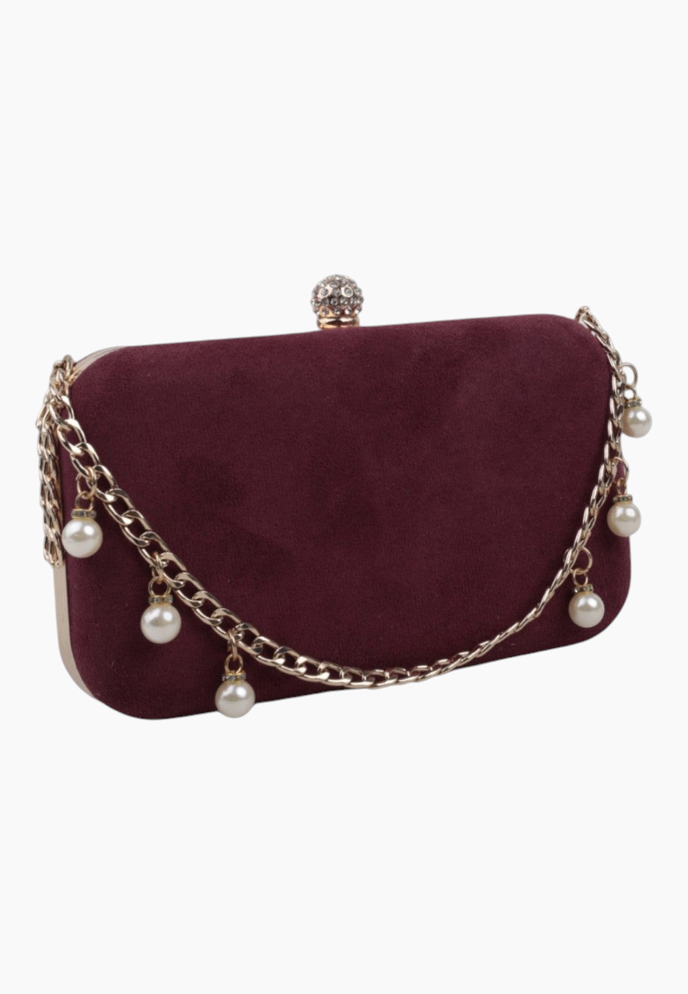 Front view of the burgundy clutch bag with chain strap and pearl accents.