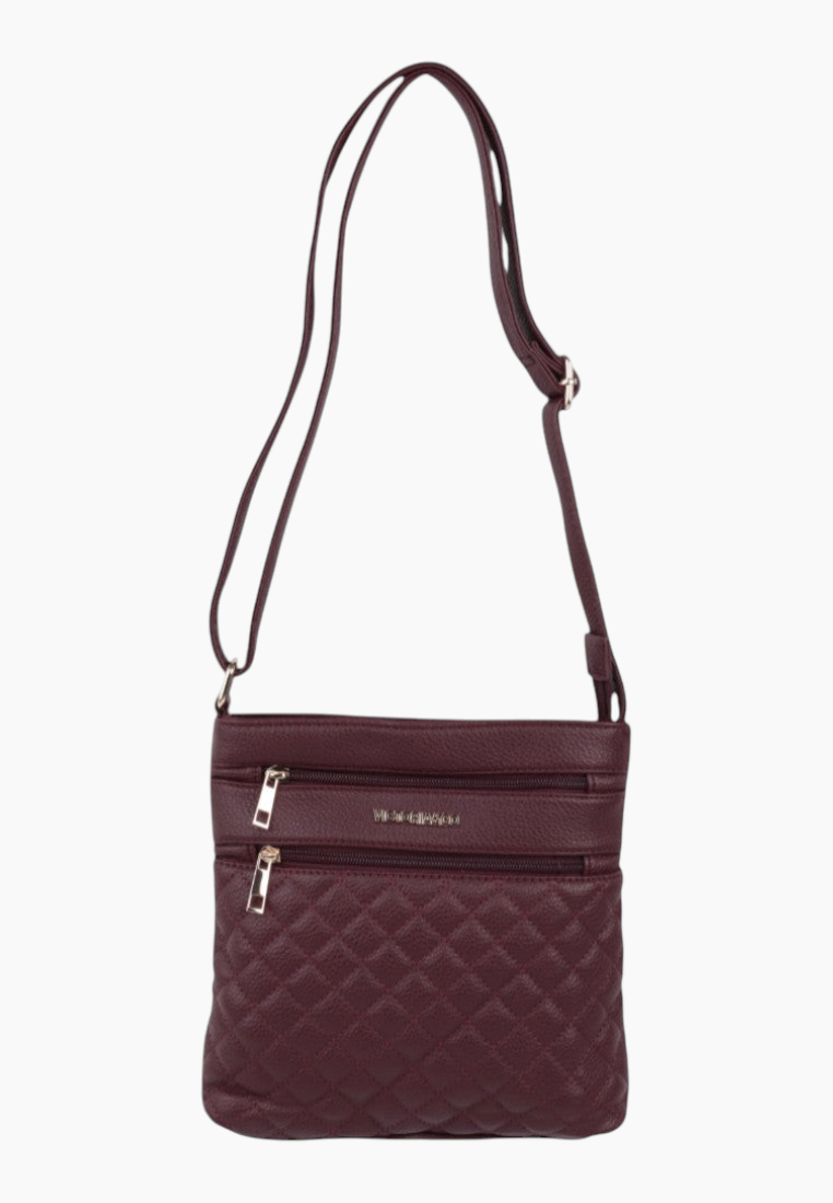 Back view of burgundy quilted handbag featuring adjustable strap and zipper pockets